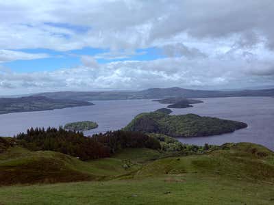 Loch Lomond and its islands from the summit of Conic Hill, with the sky opening up overhead