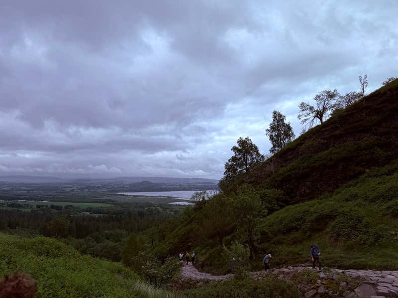 Looking back down the trail, the loch already showing through the gap