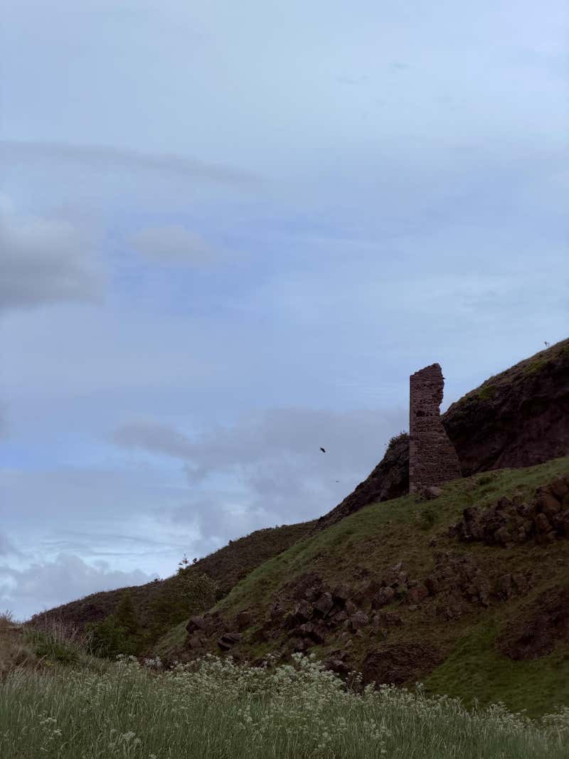 The lone surviving wall of St Anthony's Chapel on the hillside