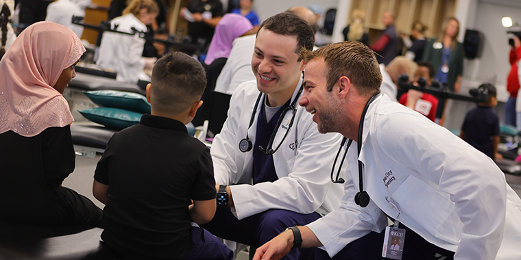 KCU students giving SVN student exam during Score 1 for Health Wellness Day