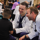 KCU students giving SVN student exam during Score 1 for Health Wellness Day