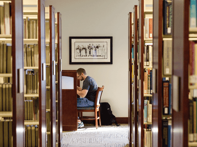 student studying in library