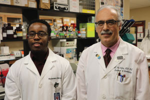 KCU Researchers Muriu and Dr. Agbas