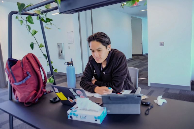 Student studying using wireless devices