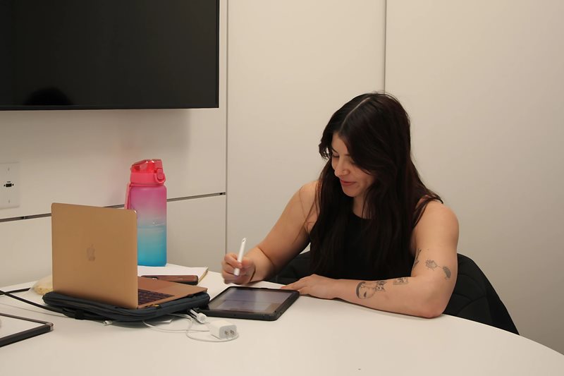 Student studying using laptop and iPad