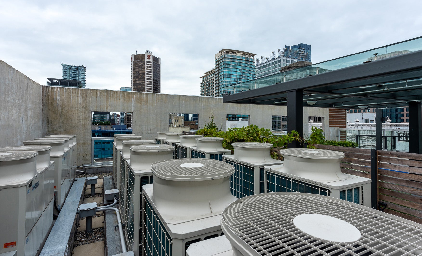 Rooftop Mitsubishi Electric CITY MULTI outdoor HVAC units at 510 Seymour mixed-use building in downtown Vancouver.