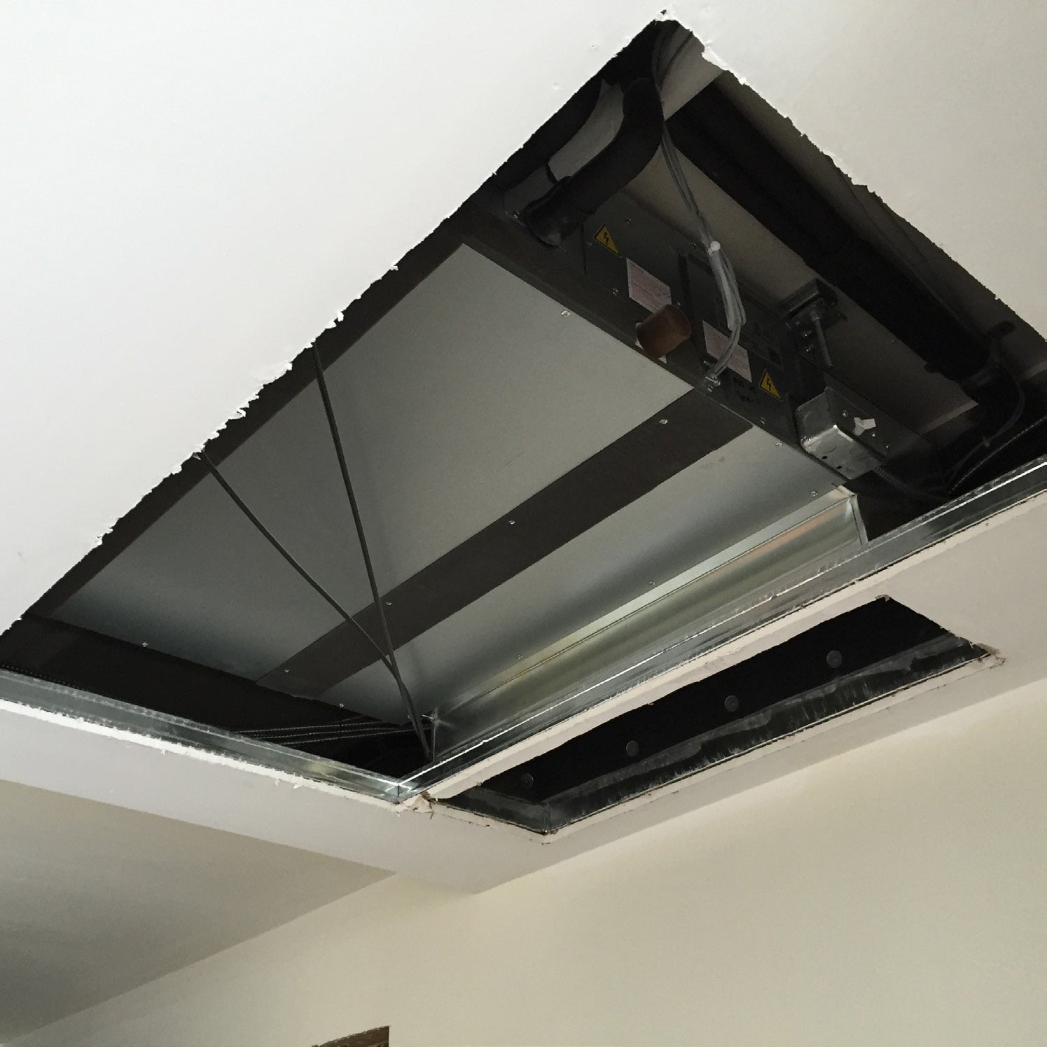 Mitsubishi Electric concealed ceiling fan coil unit installed in a Victoria Common condominium suite