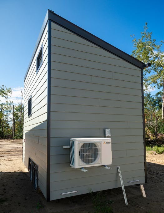 Mitsubishi Electric heat pump mounted on a Small Living Company tiny home