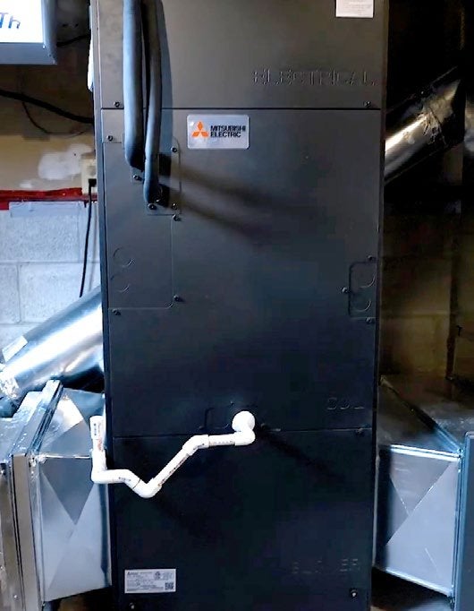 Mitsubishi Electric Zuba Central PVA-A42NA air handling unit connected to existing ductwork in the Stacey House