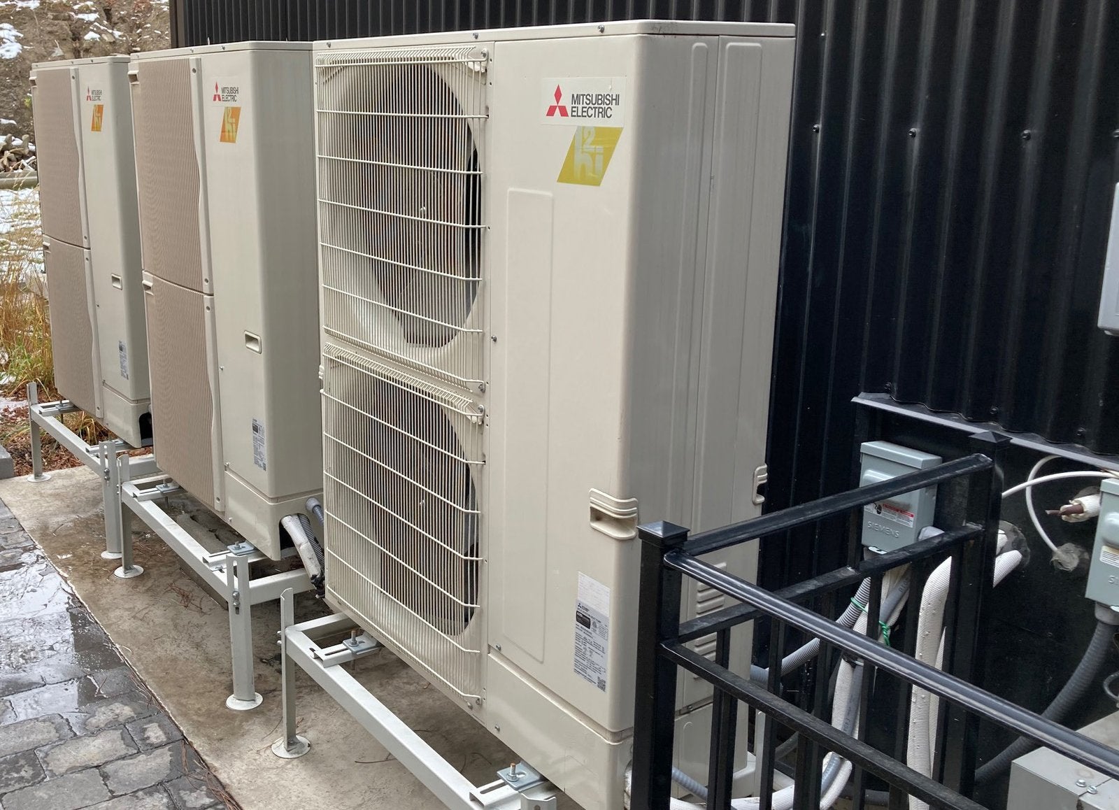 Mitsubishi Electric Zuba cold-climate heat pump outdoor units at the Molson Triplex
