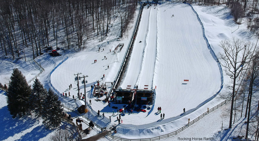 Sledding down a hill at Rocking Horse Ranch in upstate NY