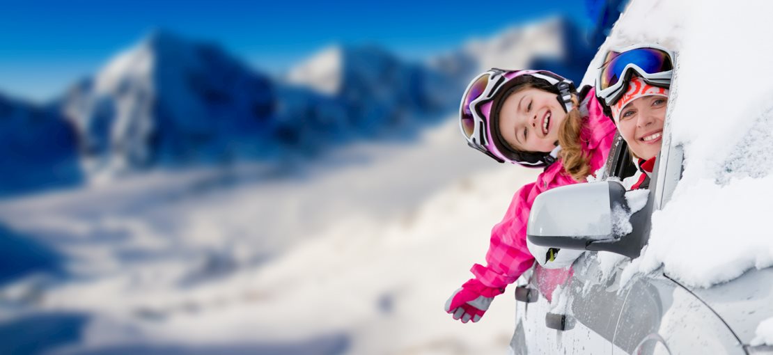 girl skiing down a ski slope