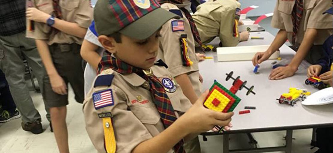 Boys Scouts building with Legos