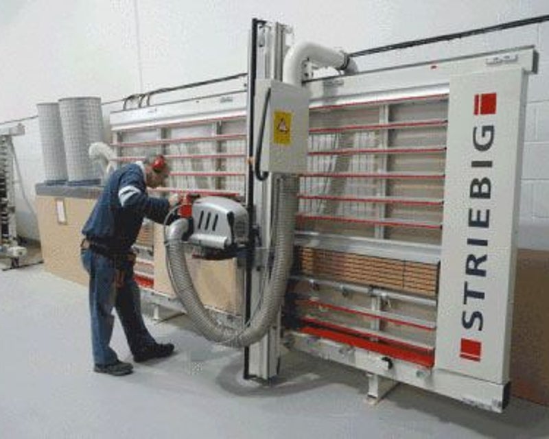 Panel saw operator cutting wood components at the PRO Pallet facility