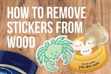 Two stickers glued to a piece of wood.