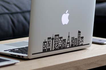 Stickers on a MacBook.