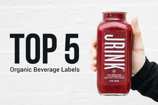Hand holding organic beverage with clear label