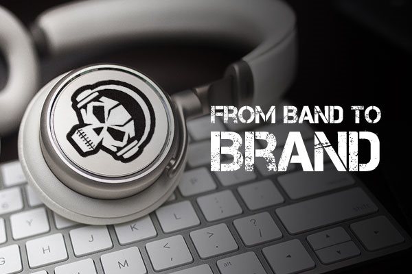 Custom die-cut band logo sticker on a pair of headphones