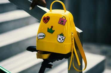 A backpack with five patches on it.