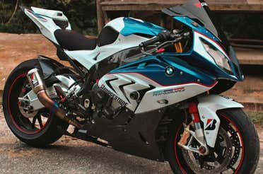 A BMW motorcycle with stickers on it