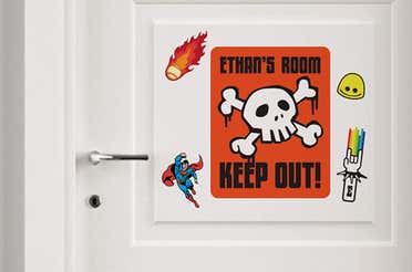 A door in a home with stickers on it.