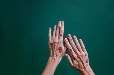 Hands decorated with temporary tattoos.