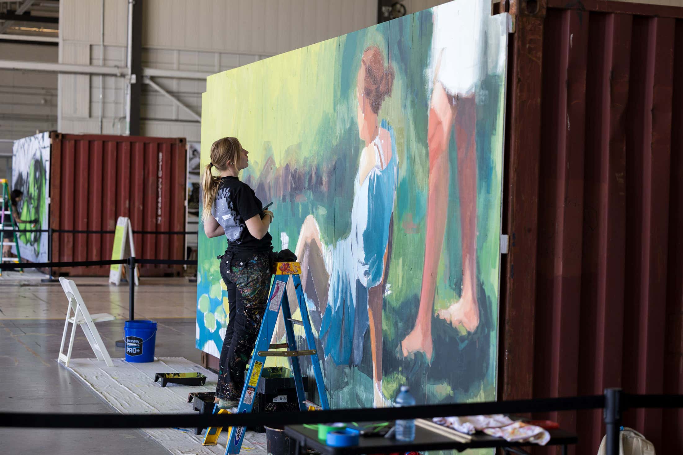 Photo of a women working on her art piece