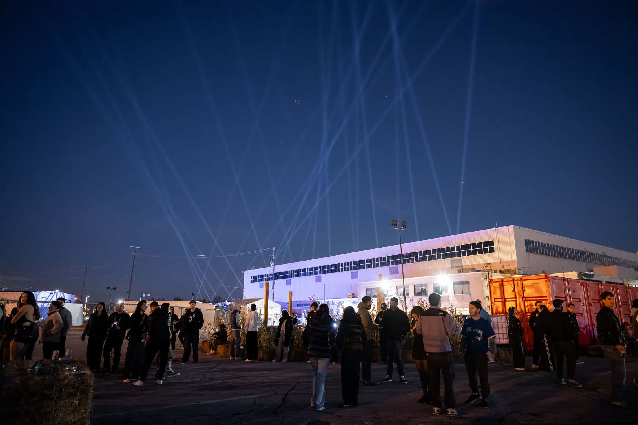 Photo of crowd gathered at nighttime for outdoor event