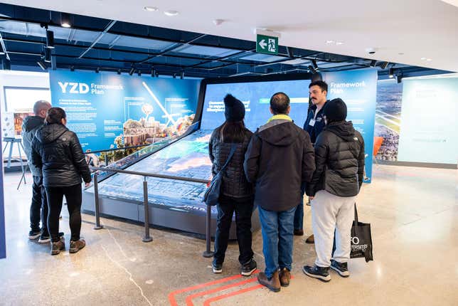 Photo of people looking at the framework model