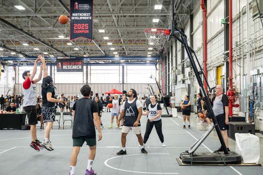 Photo of athletes playing basket ball