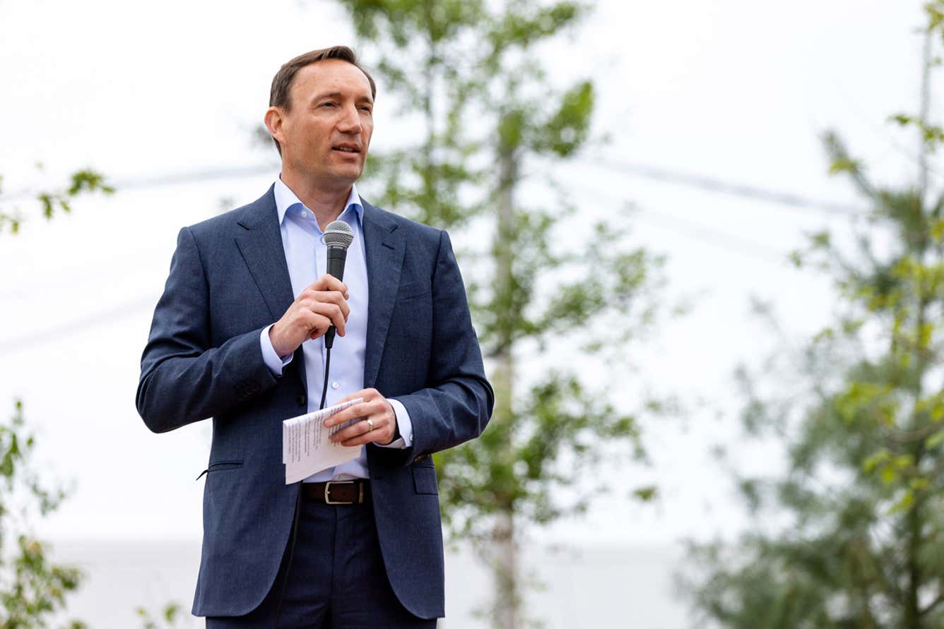 Photo of a Person Addressing the Crowd