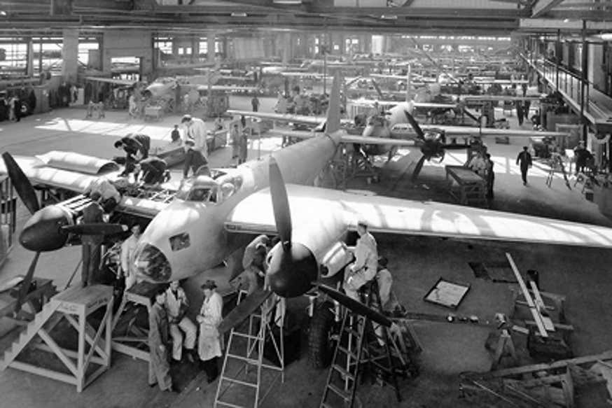 Photo of aircraft in a building being assembled